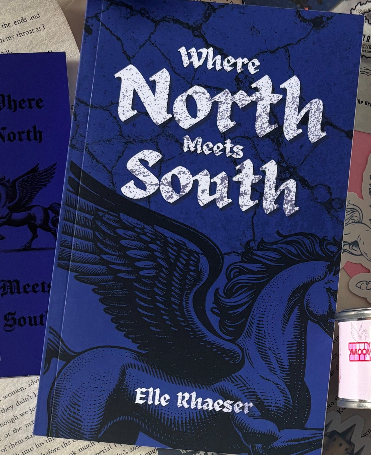 When North Meets South by Elle Rhaeser Book Box, includes book, bookmarks, stickers, author note, sweets and candle
